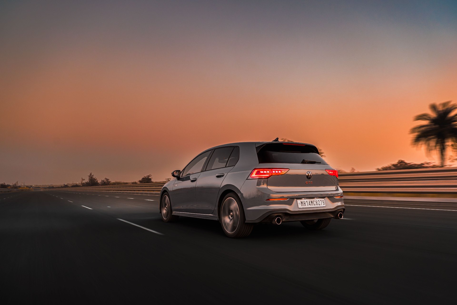 Volkswagen driving on a track at sunset