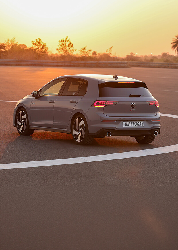 Volkswagen GTI driving on the circuit at sunset