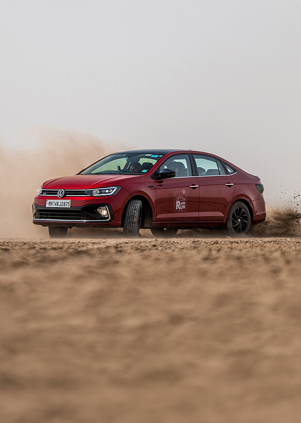 Volkswagen GT vehicle driving on loose terrain
